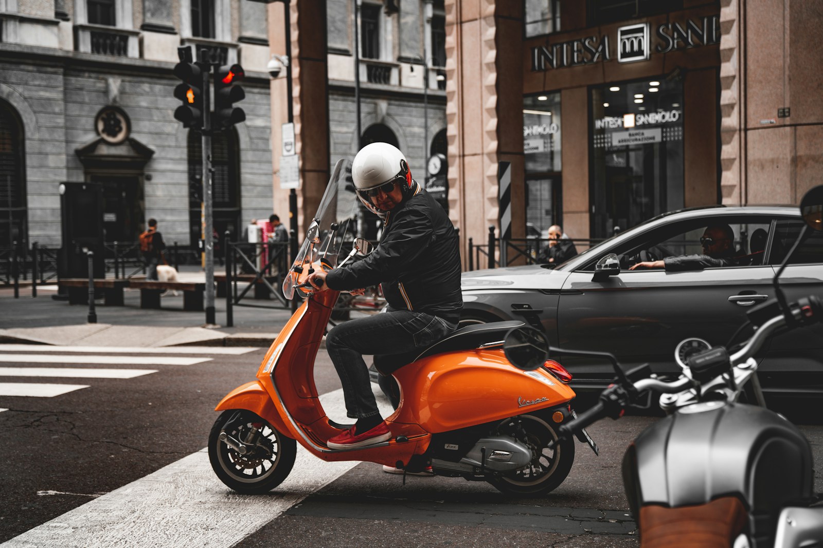 men's orange and black motor scooter